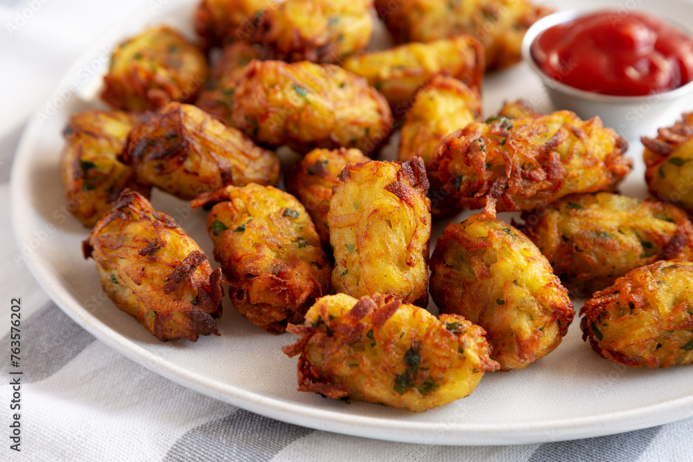 Homemade Fried Tater Tots on a Plate, side view. Homemade Fried Tater Tots on a Plate, side view.