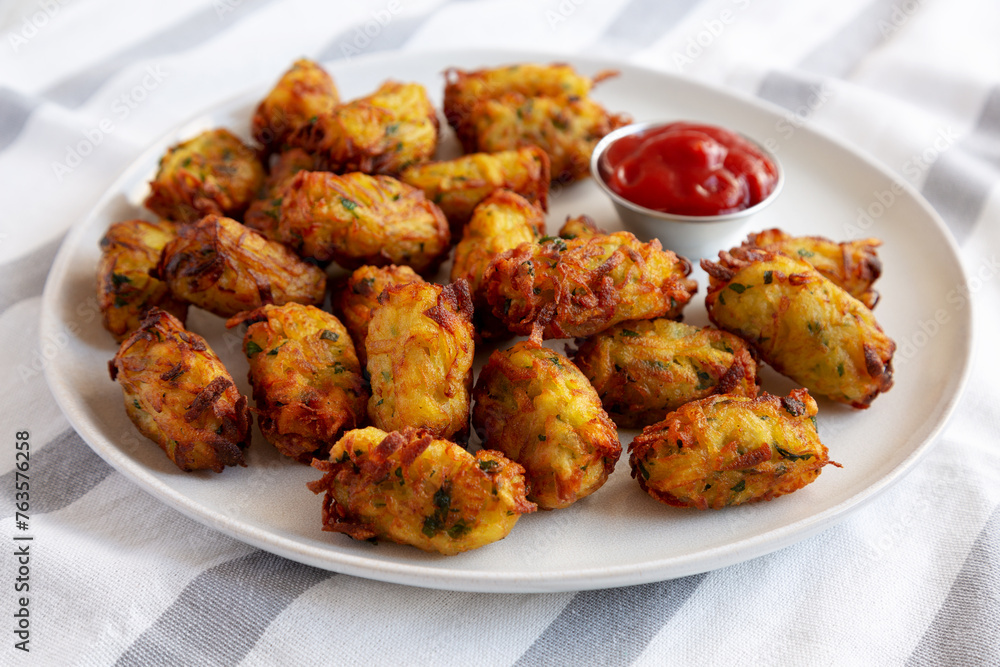 Homemade Fried Tater Tots on a Plate, side view. Homemade Fried Tater Tots on a Plate, side view.