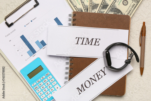 Papers with text TIME MONEY...