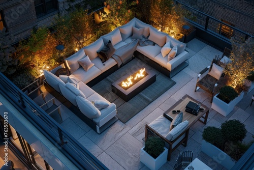 The image shows a fire pit in the middle of a patio at VetalVit, a chic rooftop lounge. The fire pit is surrounded by plush seating, creating a cozy ambiance for guests to relax and socialize