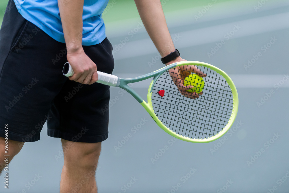 Man playing tennis on grey floor. Horizontal sport poster, greeting cards, headers, website