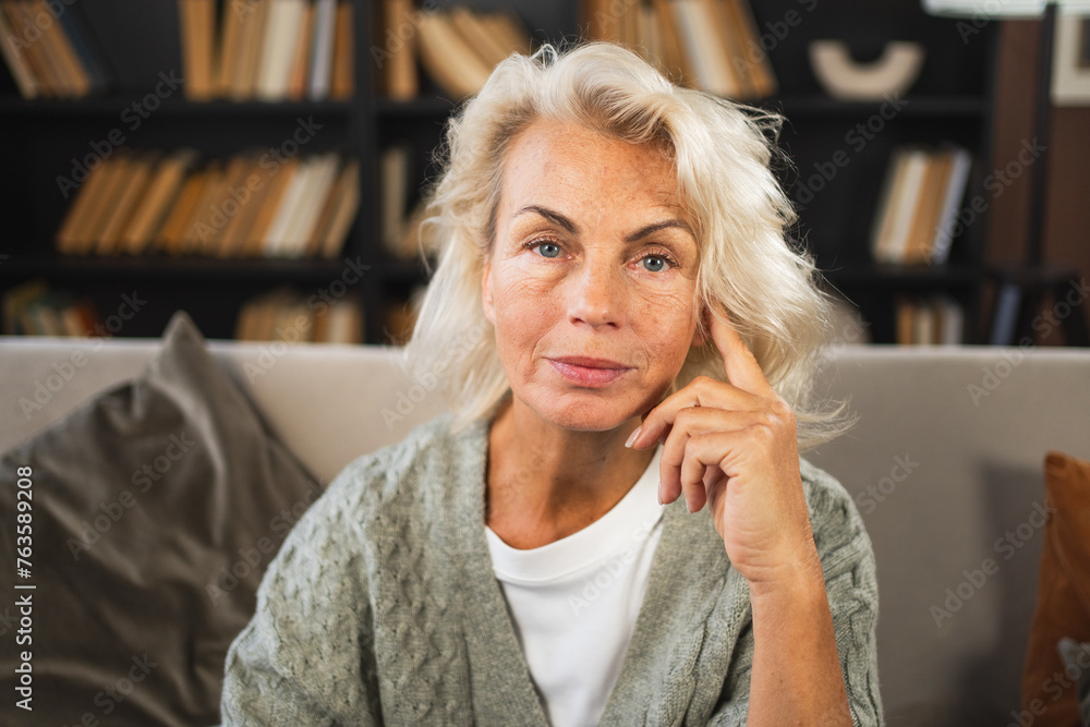 Portrait of confident stylish European middle aged senior woman. Older mature 60s lady smiling at home. Happy attractive senior female looking camera close up face headshot portrait. Happy people Portrait of confident stylish European middle aged senior woman. Older mature 60s lady smiling at home. Happy attractive senior female looking camera close up face headshot portrait. Happy people