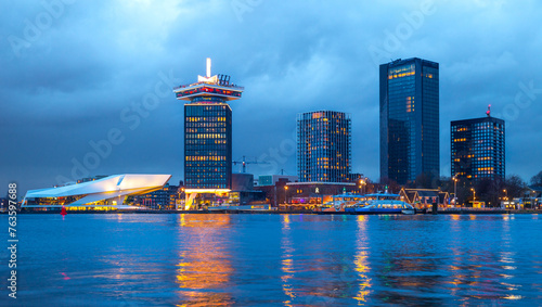 Amsterdam noord city skyline with reflection in the IJ river  at sunset, metropolitan, skyscraper, Eye Film Museum  photo