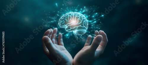 A hand holding a holographic brain represents futuristic thinking and innovation. The bright, glowing brain icon floats above the hand, symbolizing creativity, and mind control. photo