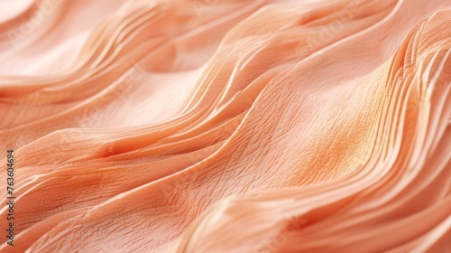 Abstract peach background with fabric texture on a blurred background with space for text. Delicate, flowing peach-colored fabric, capturing the intricate textures and graceful waves. Concept: The