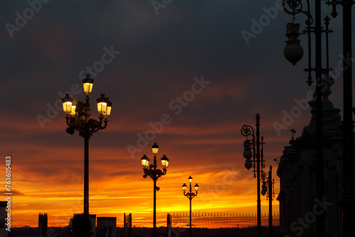 Streetlight illumination with a red sky at sunset