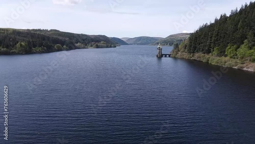 Aerial shot of the Lake Vrynwy in Wales, with a point tower visible on the right side. photo