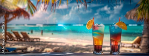 Cocktails at a beach bar at tropical resort. Colorful drinks in the sand by the sea, lights in the background. Summer vacation background, banner for travel, tourism, party. 