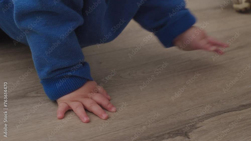 Closeup of a baby boys hands as he crawls Closeup of a baby boys hands as he crawls