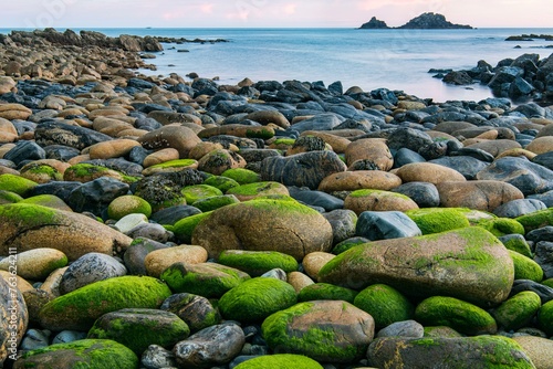 Rocky coast with round stones at Cape Cornwall, St Just, Penwith, Cornwall, England, Great Britain photo