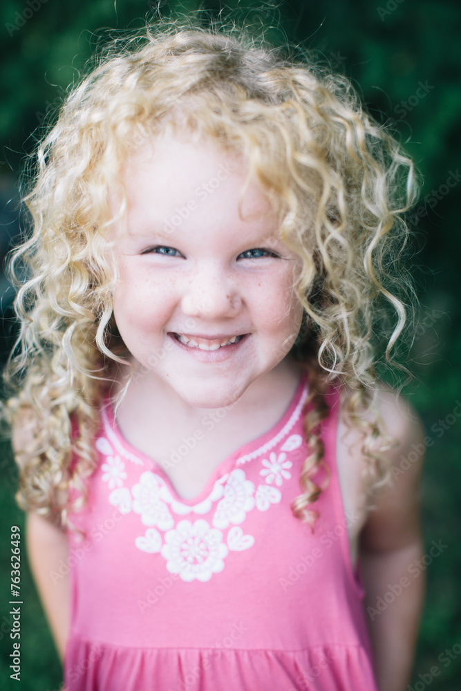 Blond girly haired girl smiling with summer dress on Blond girly haired girl smiling with summer dress on