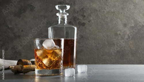 On the Rocks: Whiskey with Ice Cubes in Glass and Bottle on Table, Space for Text