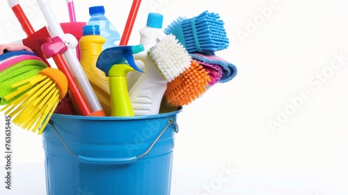 A collection of cleaning supplies within a bucket, isolated on a white background, underscoring the array of tools available for housework