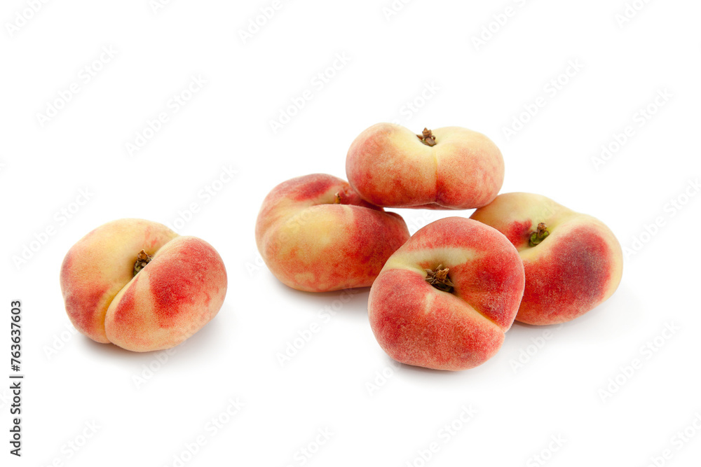 Several saturn peaches or flat peaches isolated on white background with clipping path.. Several saturn peaches or flat peaches isolated on white background with clipping path..