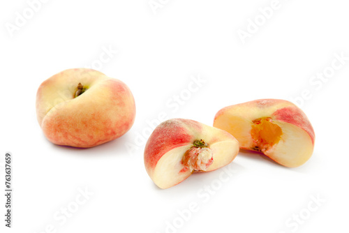 Whole and half of saturn peach or flat peaches isolated on white background with clipping path..