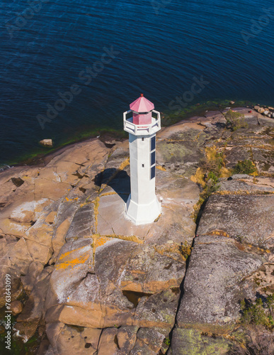 Summer aerial view of Povorotny lighthouse, Vikhrevoi island, Gulf of Finland, Vyborg bay, Leningrad oblast, Russia, sunny day with blue sky, lighthouses of Russia travel photo