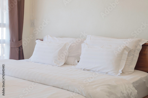 White bed linen with pillows 