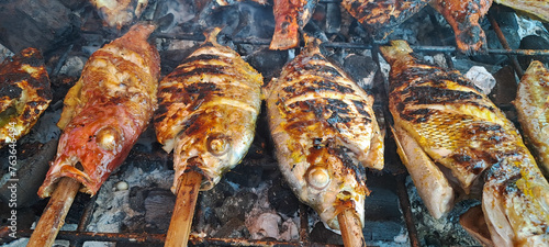 cooking fish on grill