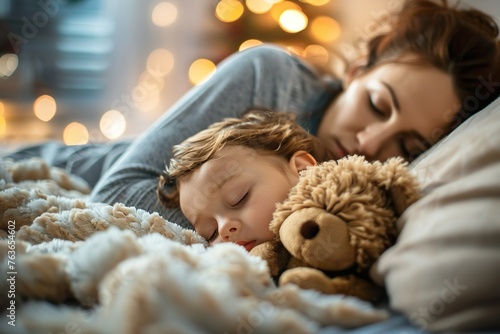 A tender moment of a parent tucking their child into bed. photo