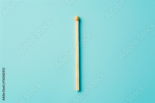 A matchstick is shown on a blue background