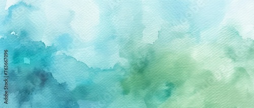 Soft watercolor strokes create a soothing abstract in cool blue and green tones, invoking a sense of calm.