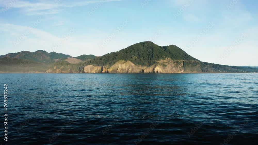 Aerial view hovering over calm surface of Pacific Ocean, looking towards Oregon Coast. Aerial view hovering over calm surface of Pacific Ocean, looking towards Oregon Coast.