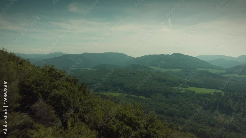 Epic drone shot flying over a hill, overlooking a valley, spectacular view in the middle of the day, beautiful nature, summer. Epic drone shot flying over a hill, overlooking a valley, spectacular view in the middle of the day, beautiful nature, summer.