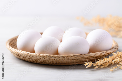 Organic white leghorn egg from free range farm in natural basket