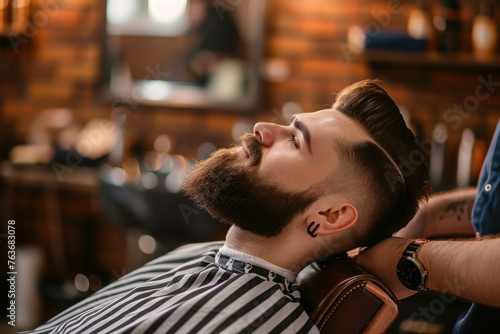 Confident man receiving grooming services in modern barbershop. Men's style and grooming.