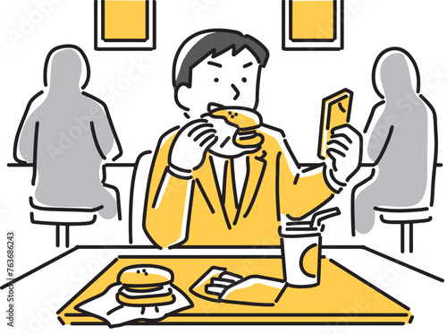 食事をしながらスマホを見ているビジネスマン