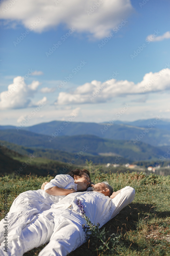 Adult couple walk in the mountains