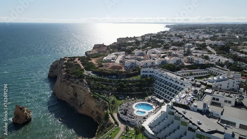A spectacular drone shot of Hotel Tivoli Resort, and the stunning sea cliffs and sea caves of 