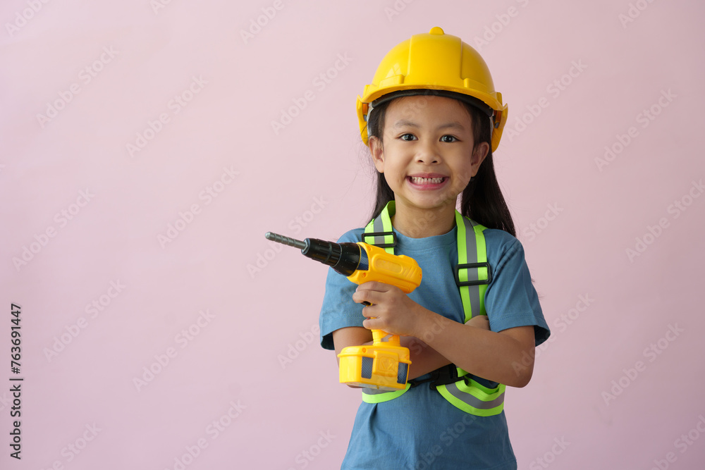 A little girl in a construction helmet and repair equipment Improving the premises About redevelopment, perspective ideas, planning, house design, architects, engineers, future careers. A little girl in a construction helmet and repair equipment Improving the premises About redevelopment, perspective ideas, planning, house design, architects, engineers, future careers.