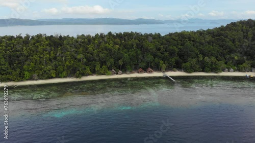 Dense Tropical Forest At Lumba Lumba Guesthouse In Kri Island, Raja Ampat archipelago in Indonesia. Aerial Drone Shot photo