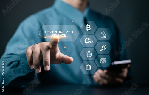 DeFi, Decentralized Finance concept. Blockchain, decentralized financial system and business technology. Businessman touching Decentralized Finance word with icon on virtual screen.