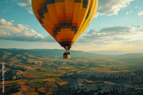A hot air balloon is flying over a beautiful landscape