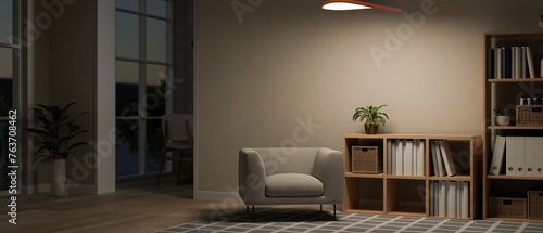 The interior design of a contemporary living room at night with a cosy armchair and decor.