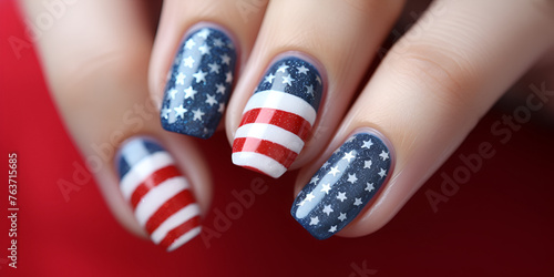 a woman with red blue and white nails with stars on it beauty nailcare nailpolish blured background photo