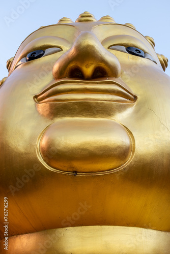 Head of Golden Buddha on white background