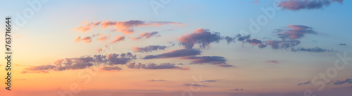 Real sunrise against the sky with pink colorful clouds. Without any birds. Large panoramic photo. This is real heaven