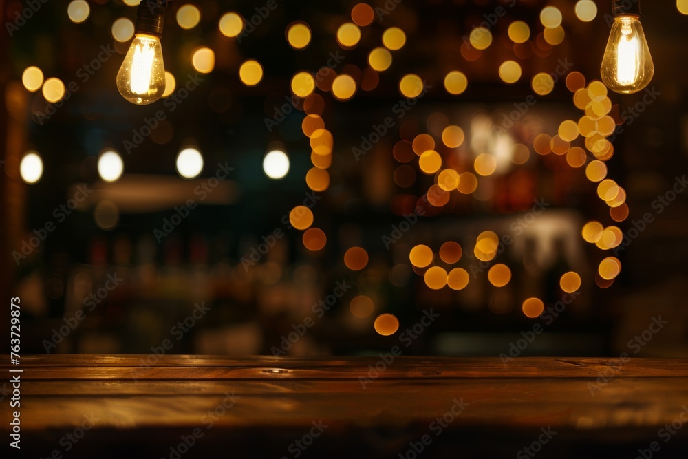 Empty wooden table with a blur of warm bokeh lights, setting the scene for a romantic or festive occasion - obrazy, fototapety, plakaty 