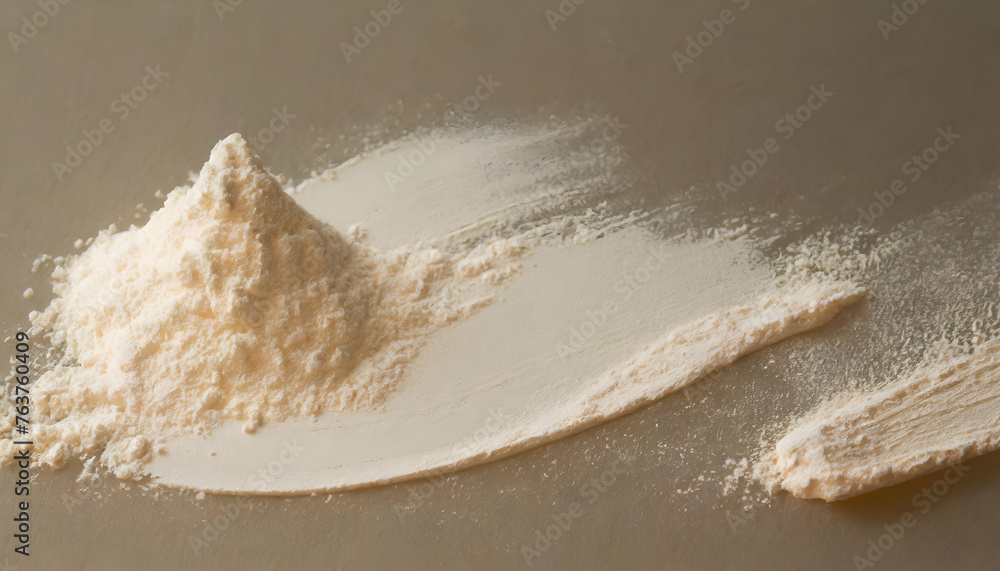 pile of a cream color powder on ivory color background