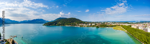 Fototapeta Naklejka Na Ścianę i Meble -  Annecy, France. Lake Annecy with surrounding mountains and villages. Panorama in summer. French Alps. Aerial view