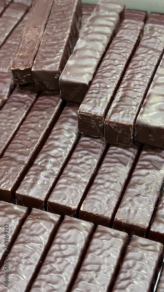 Production of chocolate candy. Sweets on conveyor belt at factory . High quality 4k footage Production of chocolate candy. Sweets on conveyor belt at factory . High quality 4k footage
