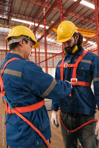 Team of engineers or workers getting safety suits and helmet.