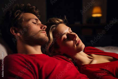 Content Young Couple in Red Sleepwear Sleeping Soundly, Depicting Trust and Comfort in a Relationship During a Calm Night
