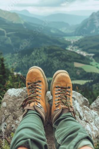 close-up of hiking boots overlooking a mountain landscape