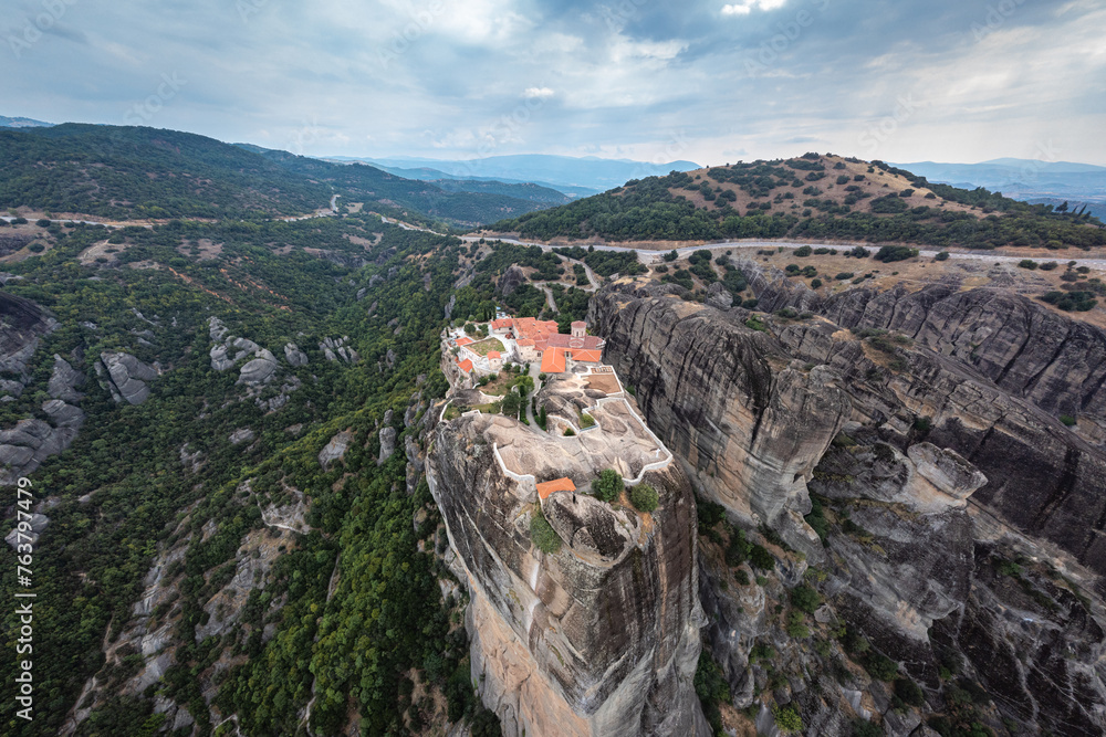 Top high aerial drone view of Monastery of the Holy Trinity (Agia Triada) in Meteora, Greece. A UNESCO World Heritage site.