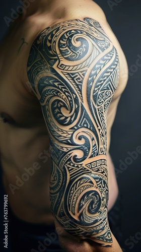 The bold presence of a Maori-inspired sleeve tattoo on a man's arm, its intricate swirls and tribal motifs wrapping around his bicep against a clean, solid backdrop.