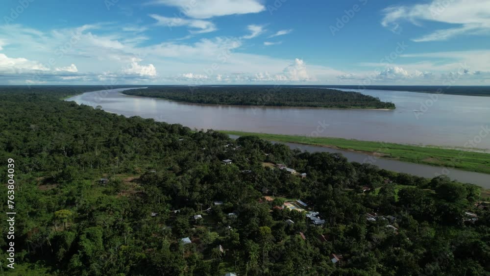 Aerials shot of the dense Amazon forest and settlements in Colombia Aerials shot of the dense Amazon forest and settlements in Colombia